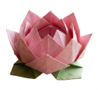 Pink origami lotus flower with green leaves on a wooden surface